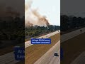 Fire Rages On Edge Of I-75