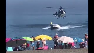 Police helicopter chases narco speedboat onto crowded beach 🚁