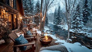 Relaxing Winter Snowfall By A Cozy Firepit On The Riverside Cabin Porch