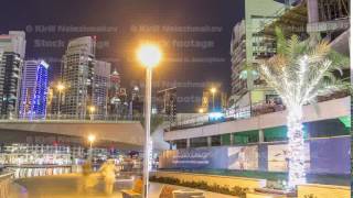 Run on promenade of Dubai Marina with view of Towers and canal in Dubai night timelapse hyperlapse