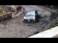 Car Speeds Down Road Trying To Escape Fast Moving River of Mud