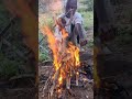 dudu prepares wild game, lights fire, cooks and enjoys tribal dinner