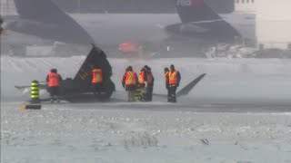 Teams of investigators trying to determine what caused Toronto plane crash