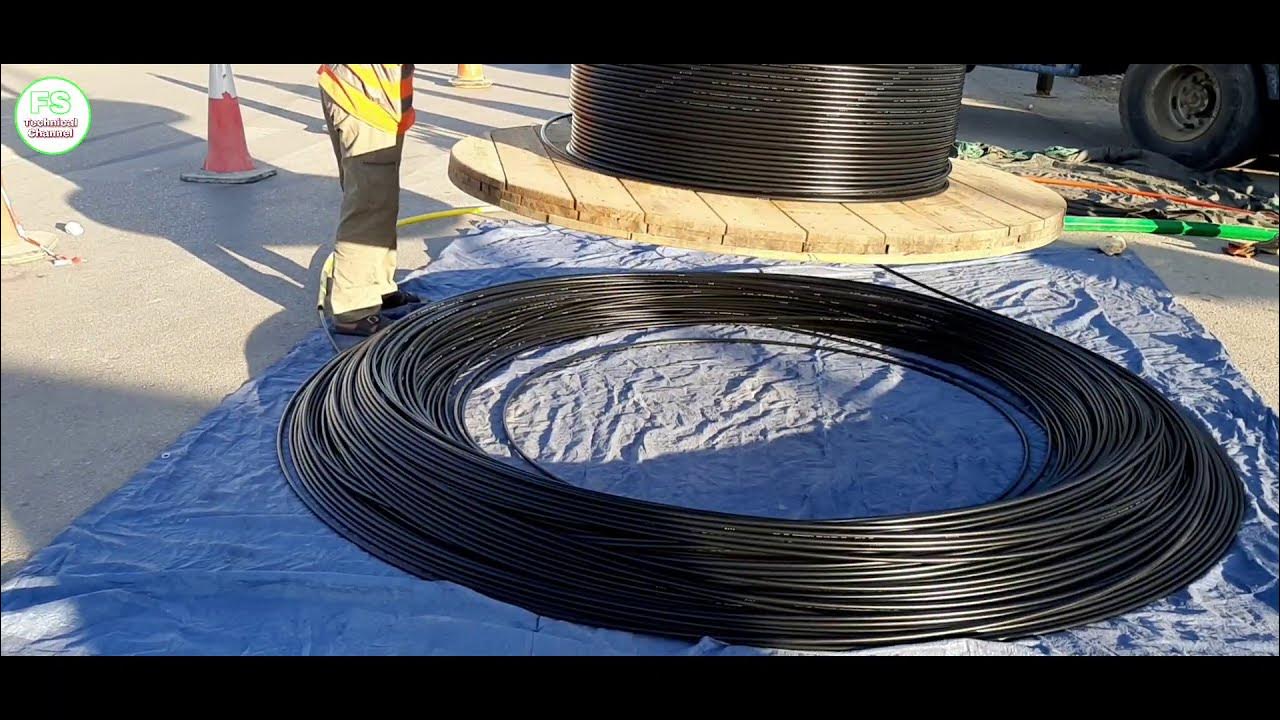 An easy way to unwind an optical fiber cable from a drum. 
