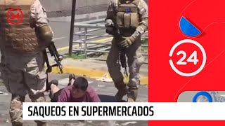 Militares y la PDI realizan masiva detención a personas que saqueaban supermercado en San Ramón