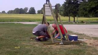 test firing the trebuchet. after 3 shots we dialed in the firing and launched a 4 lb projectile 142 feet! farthest launch was a water 