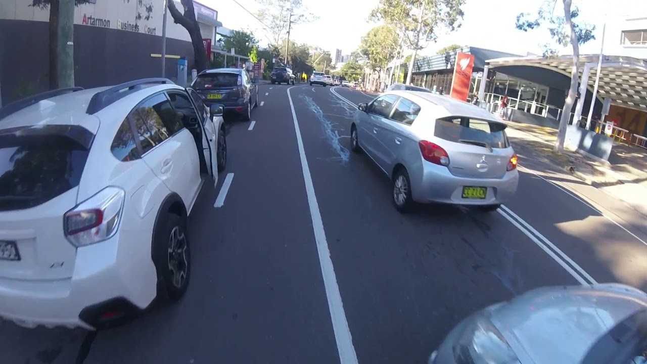 CLOSE CALL - Cyclist almost hit by car door