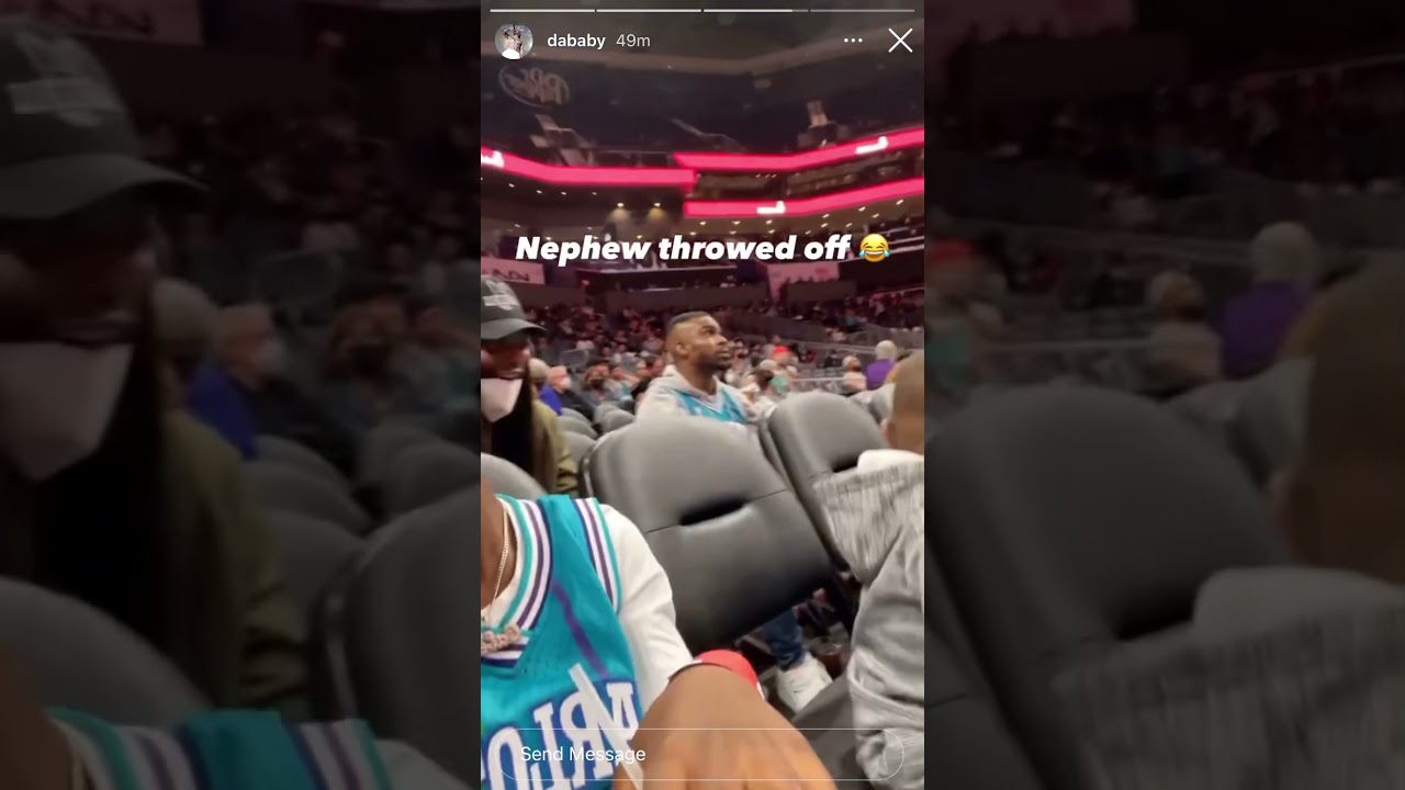 DaBaby attends the game between the Charlotte Hornets and the Los