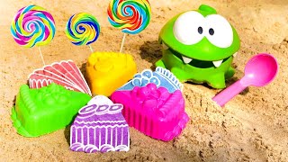 Om Nom Nom toy &amp; sand cake with surprise toys - Funny video for kids.