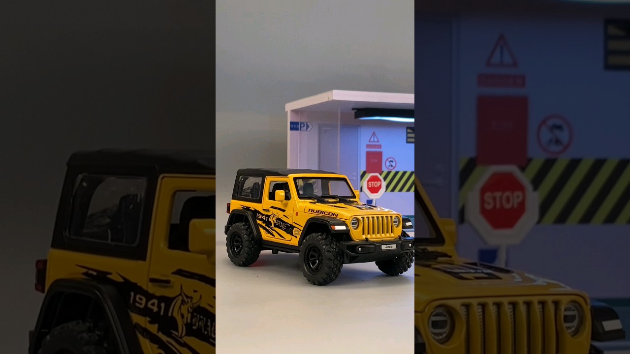 Miniature yellow Jeep Wrangler Rubicon diecast model car 