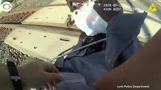 Lodi police officer saves man in wheelchair from approaching train.mp4