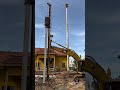 concrete piles driving by excavator