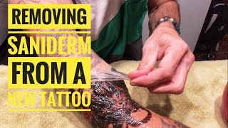 Removing saniderm from a new tattoo (Seven Stars Tattoo, Phoenixville)