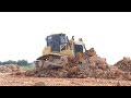 Skilled Land Clearing Staff And 12 wheel Dump Truck Unloading Soil