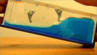 Wave Paperweight Dolphins