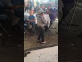 A kid dancing to la chona