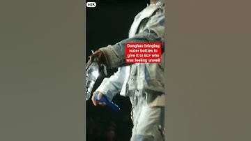 Donghae bringing water bottles to give it to ELF who was feeling unwell