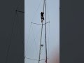 Climbing to the top of the mast