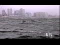 Hurricane Sandy pushing water over Manhattan seawall