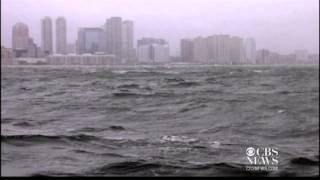 Hurricane Sandy pushing water over Manhattan seawall