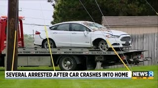 Several arrested after car crashes into home