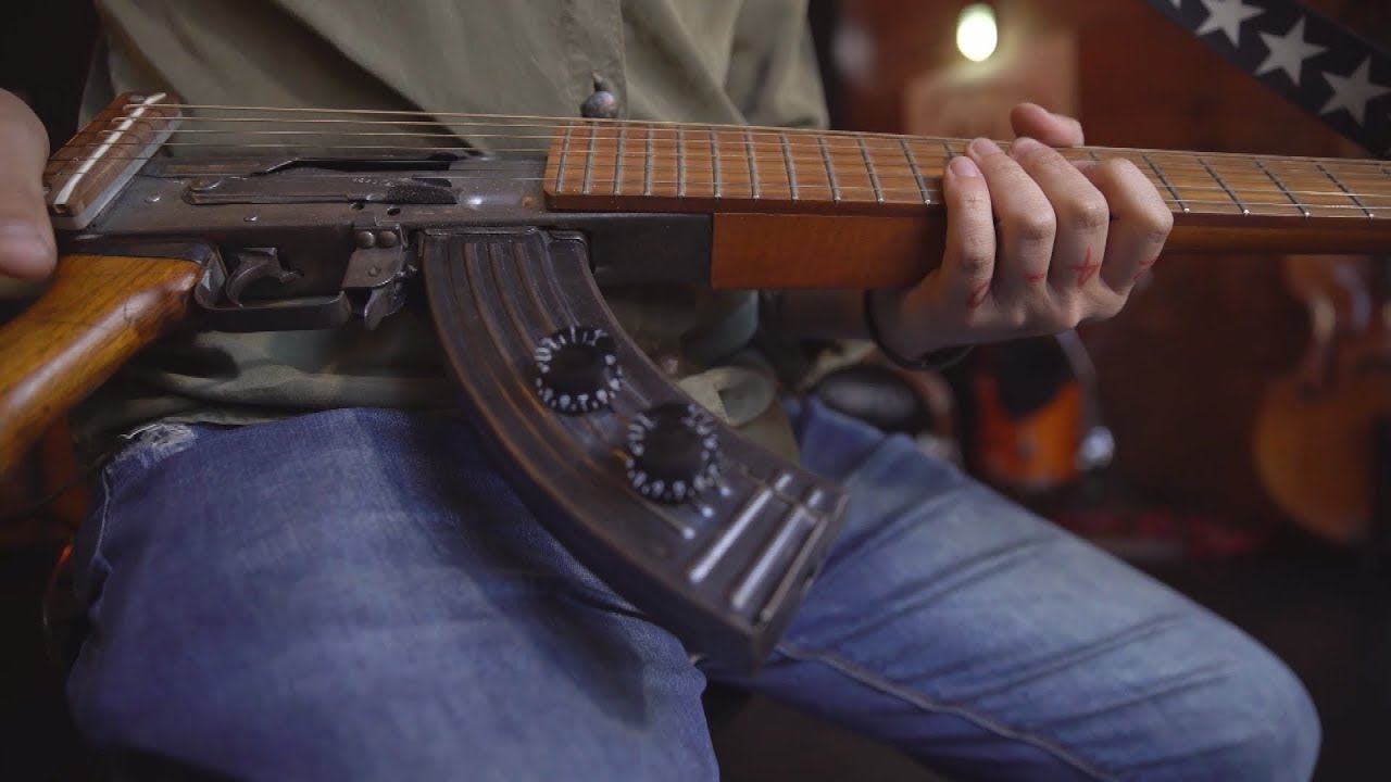 A shotgun guitar helps heal the wounds of war YouTube
