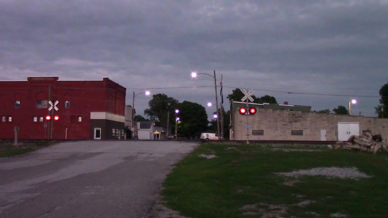 Main Street Railroad Crossing - CSX P050 with AMTK 152 in Chalmers, Indiana
