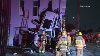 Wild Crash Leaves Car Leaning Against Building