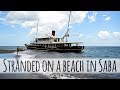 Stranded on a beach in Saba— Sailing Uma [Step 83]