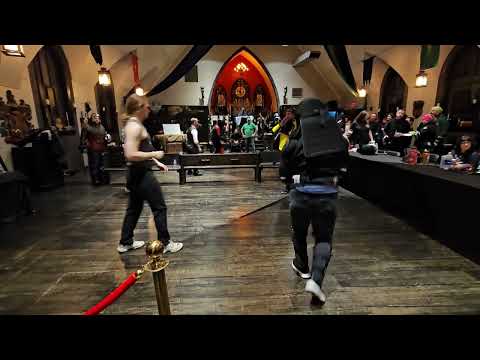 My 1st HEMA tournament ever at age 58 - Me in white bib vs Lani