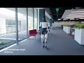 Tesla optimus humanoid robot performing sorting batteries and walking inside tesla factory 52024