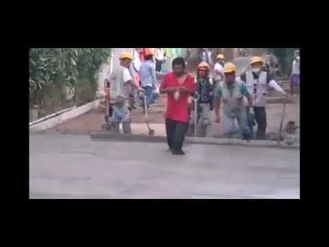 Man walking over  fresh concrete