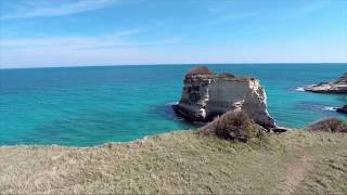 Flying through the sea stacks of Torre Sant'Andrea in Puglia