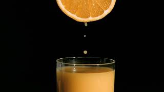 orange drops falling in super slow motion in a glass 4k #satisfying  #youtubeshorts