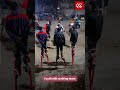 Youth stilt walking team passing on traditional culture