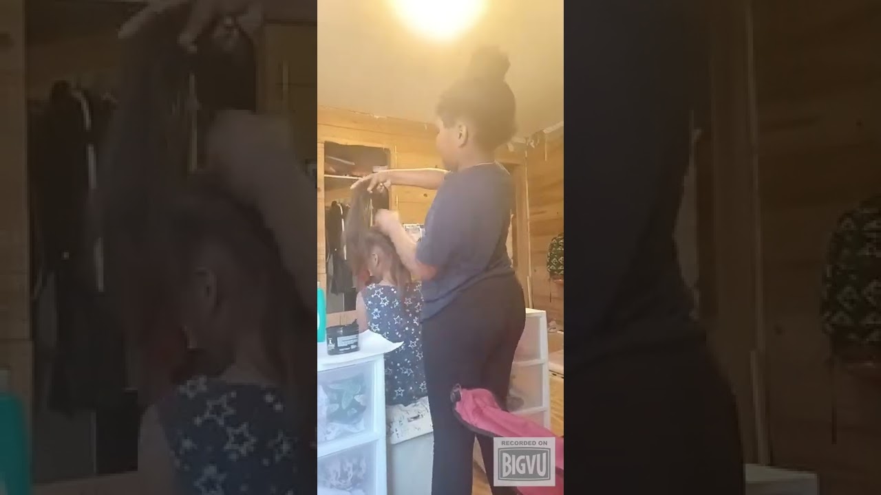 Doing my 8 year old cousin hair doing a braided ponytail.
