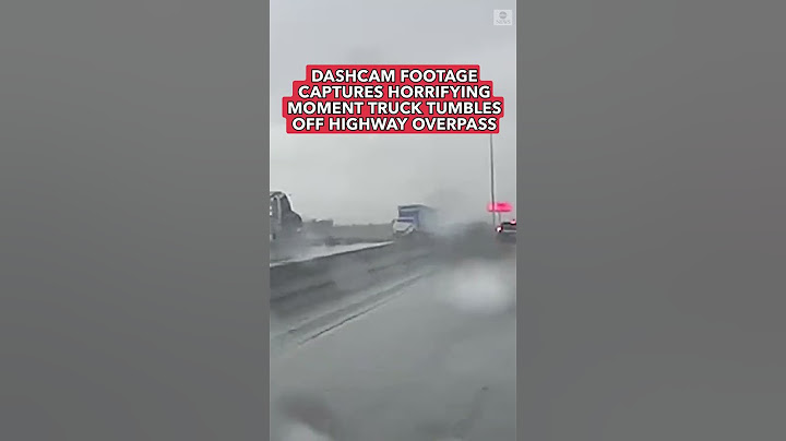 Truck plunges off highway overpass in horrifying moment