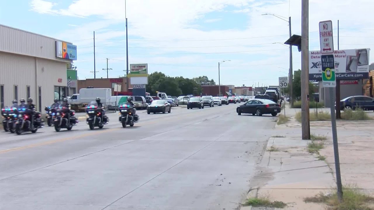 Dignified transfer of fallen Hays police officer from Wichita