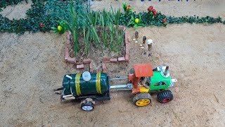 A DIY mini tractor cart pulling a water tank is|  a science project@yousef.A.thibeh