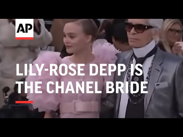 Lily-Rose Depp Hit the Chanel Runway Wearing a Pretty Flower Hair