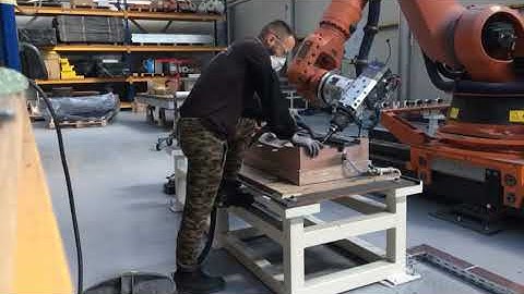 Trimming a carbon fiber parts and collaboration with a robot