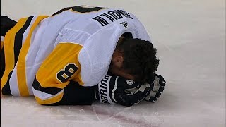 Dumoulin exits game after collision with Wilson and Ovechkin