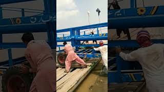 People loaded Solar trolley on boat? tractor