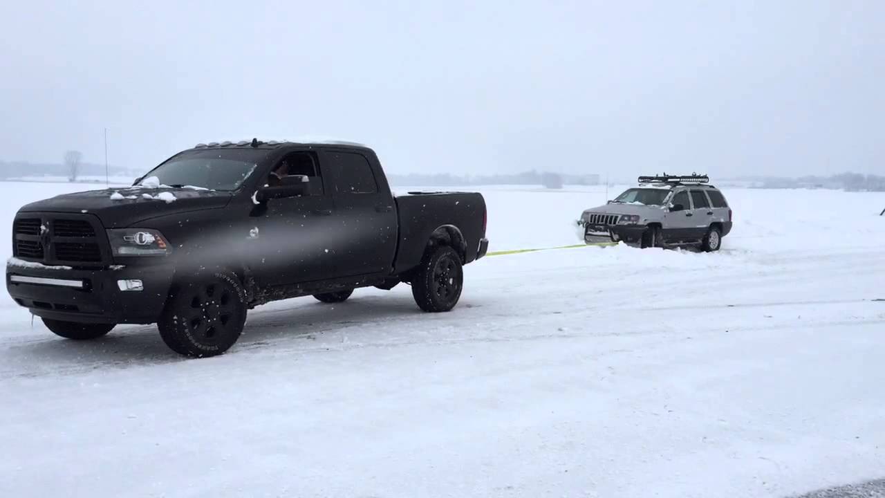 Blacked Out Cummins RAM 2500 pulls out stuck Jeep - YouTube