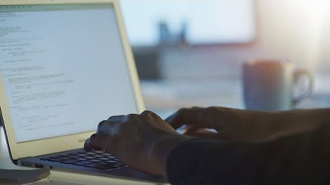 Programmer is Working in Office on Laptop | Stock Footage - Videohive