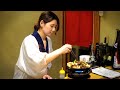 A beautiful proprietress makes exquisite grilled beef tripe. Japanese food. どん蔵 モツ