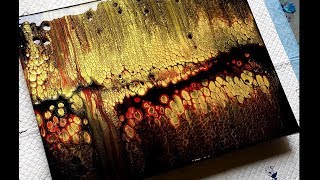 #666 Metallic Gold And Red Swipe Over A Black Background