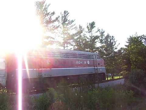 This is the Pizza Train. It usually has a Nickel Plate Road GP7 and a blue GP9, called ITM 200. The locomotive on the end is a Monon F7A, number 83-A. The train comes from the Indiana Transportation Museum in Noblesville, Indiana. Here's some info about the train and museum: The ITM is located in northern Noblesville. There is a big yard of locomotives and cars. They have a steam locomotive, Nickel Plate Road #587. This one is out of service for now, but it has been fixed by employees of the ITM. They have a Monon FP7, #96. It has had some engine problems for a while, but hopefully they can fix it up. The Pizza Train is a passenger train that starts at the Indiana Transportation Museum, (Noblesville, Indiana) and runs all the way up to Pizza Shack in Tipton, Indiana. It carries many people to dinner in Tipton. This train consists of ITM GP9 #200, 5 stainless steel budd coaches, and Monon F7A #83-A. I'm sorry about the huge glare, that's because I didn't have very much prep time to set my camera up. Hope you enjoy the PT