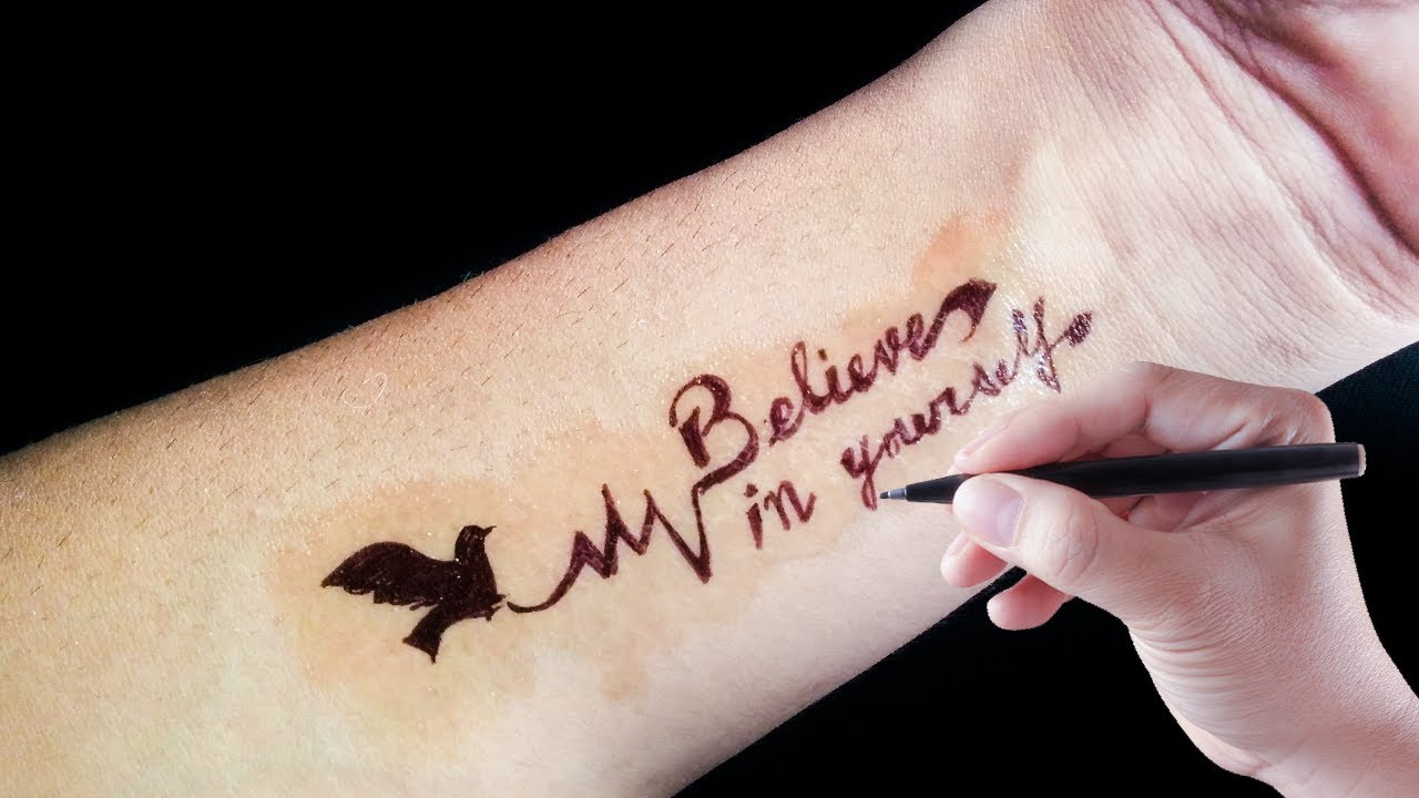 Believe in yourself lettering tattoo on the forearm