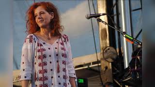 Neko Case ends show early after armed guards refuse to leave stage.